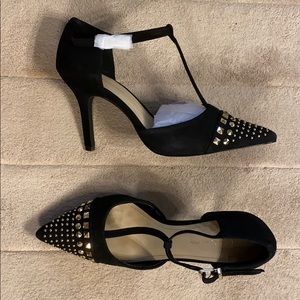 Black heels with studded toes.